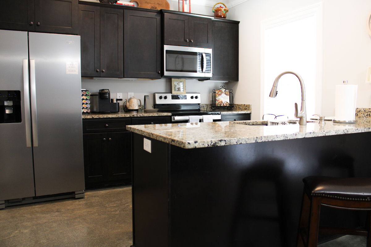 Interior of a Pinewood Place 2-bedroom townhome, kitchen counters and cabinetry